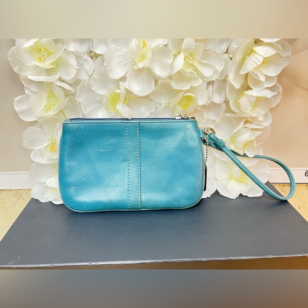Coach Legacy Leather Small Wristlet. design is featured during Coach’s 65th